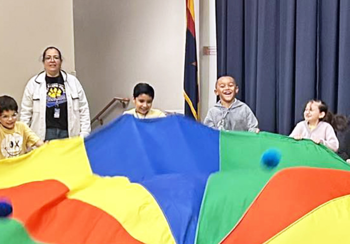 Puma students having fun with a parachute activity