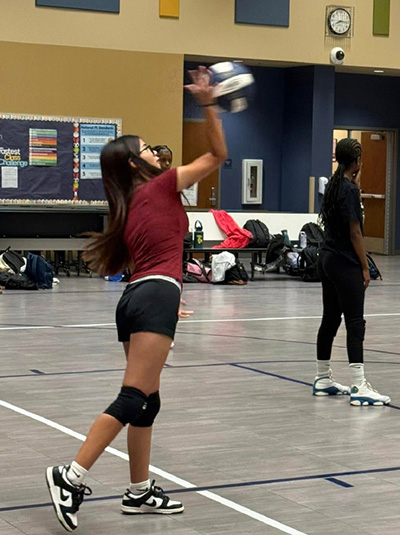 Volleyball player serving the ball