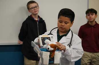 Student with veterinarian coat and supplies