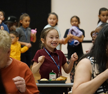 sidebar_goodnews Smiling student preparing to eat lunch