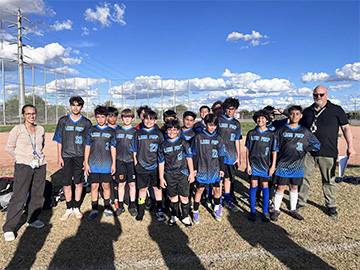 Boys soccer team and coaches
