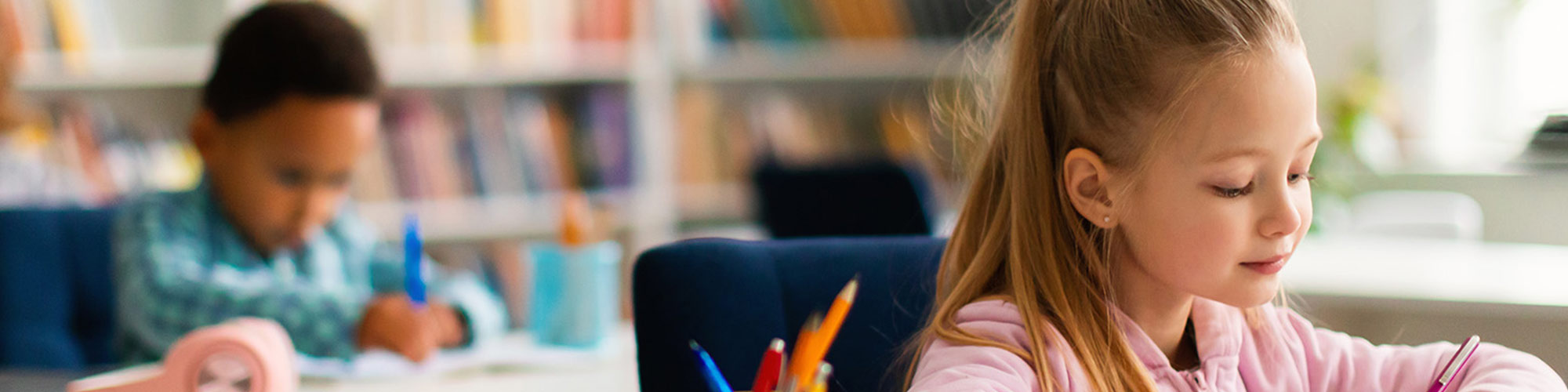 Elementary students doing work at their desks