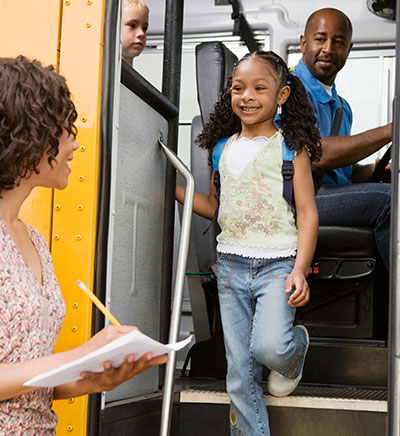 Girl walking out of a bus