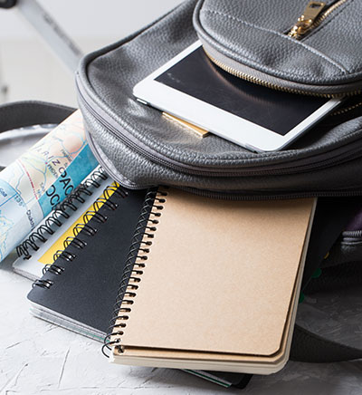 Backpack with a tablet and school supplies