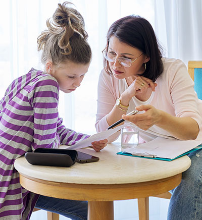Teacher helping a student with their work