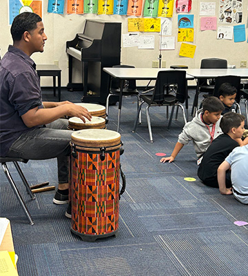 Students and staff in the music room