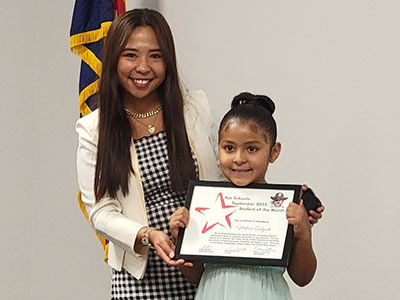 Kindergartener Milena Salgado with teacher Jeanlee Bagares.