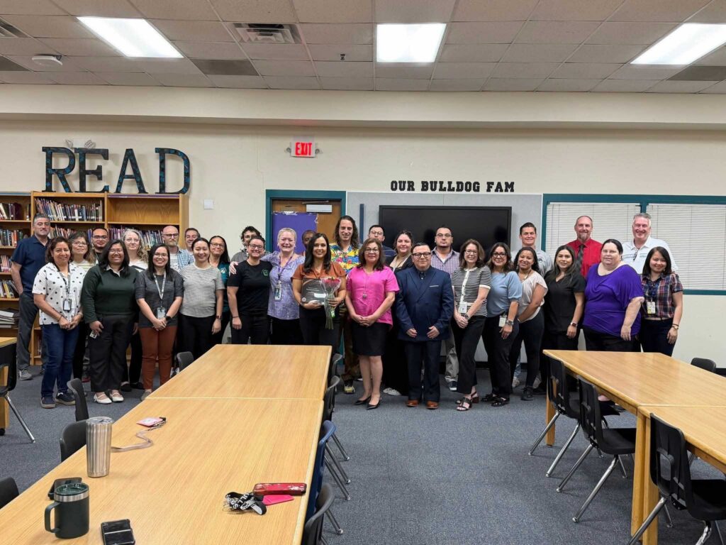 Group of staff members receiving Copper Apple Award