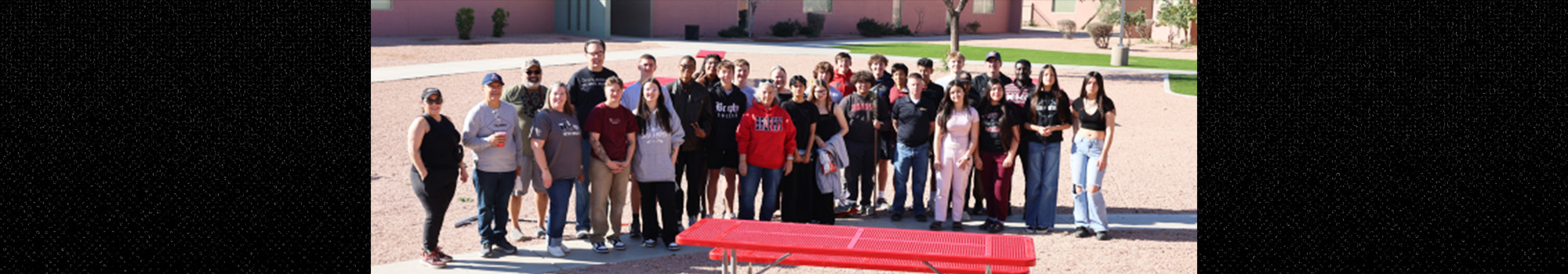 Group of happy students outside school campus posing for a picture