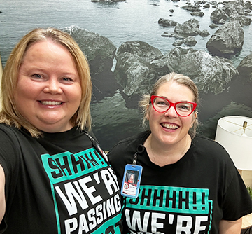 Two happy staff members