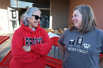 Two happy staff members