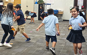 students dancing in a classroom