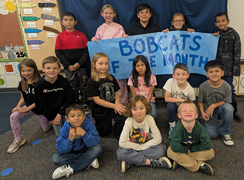 Group of happy students representing Bobcats of the Month for May 2026