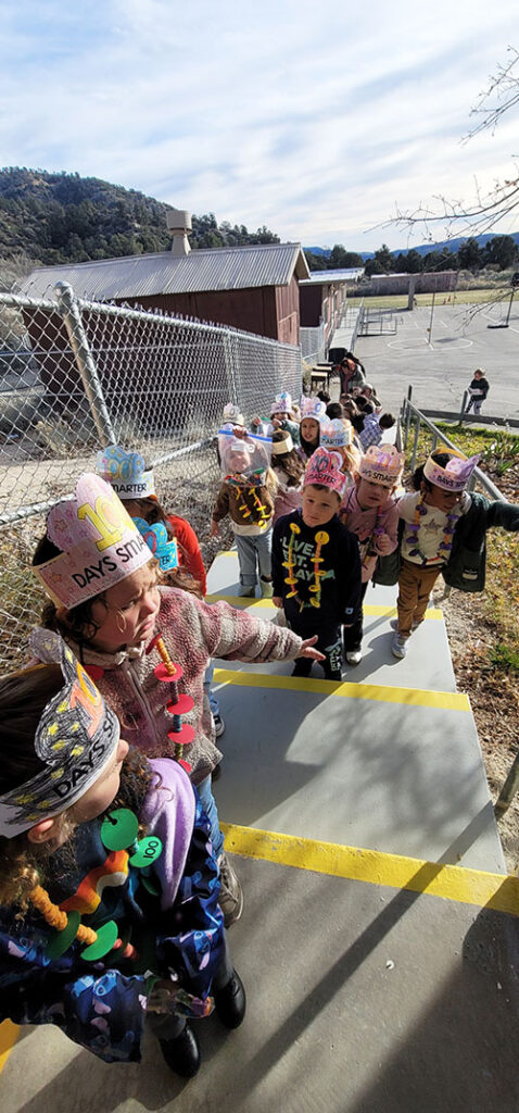 TK and kindergarten students outside waling up steps