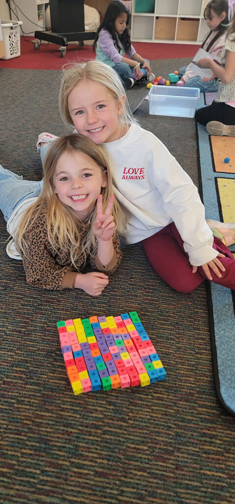 Two happy students posing for the camera