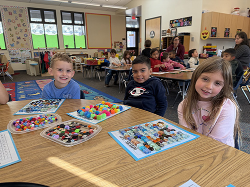 Three student smiling for the camera