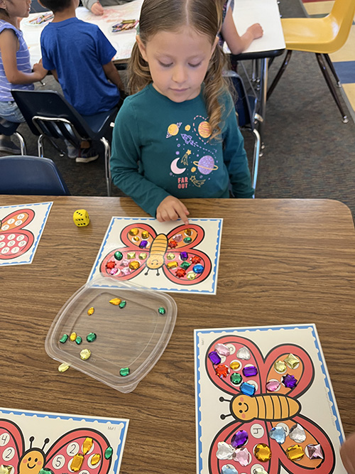 TK student working on a butterfly activity