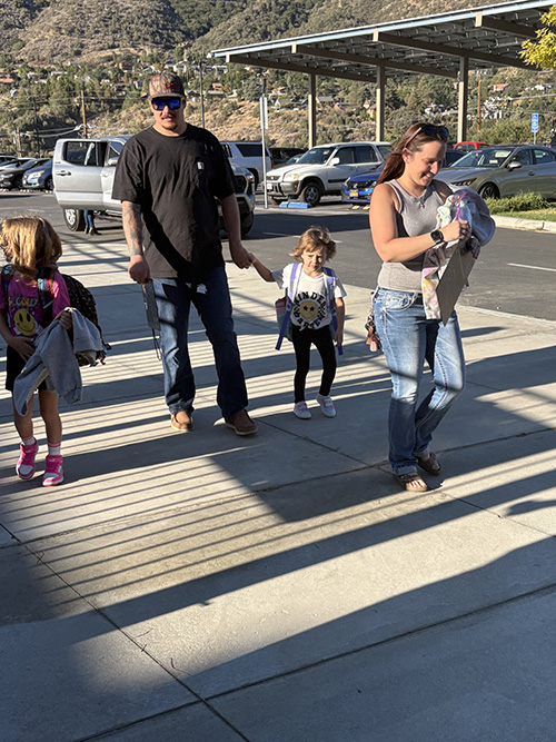 Parents walking with their children
