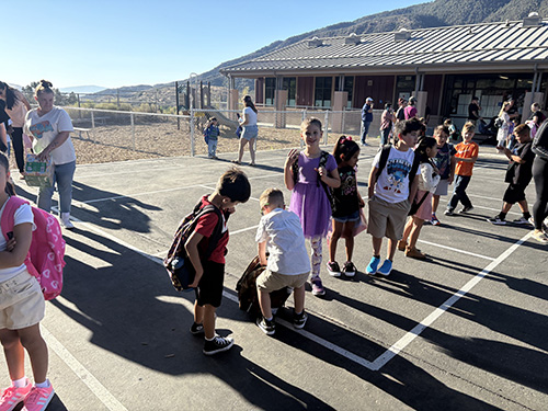 Happy students outside during first day of school