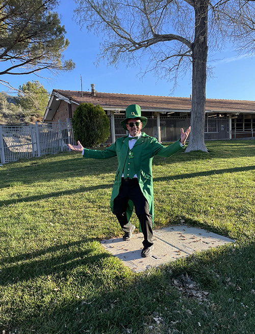 Principal McNelis dressed as a leprechaun on the school campus