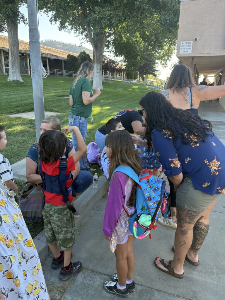 Parents and students arriving to school