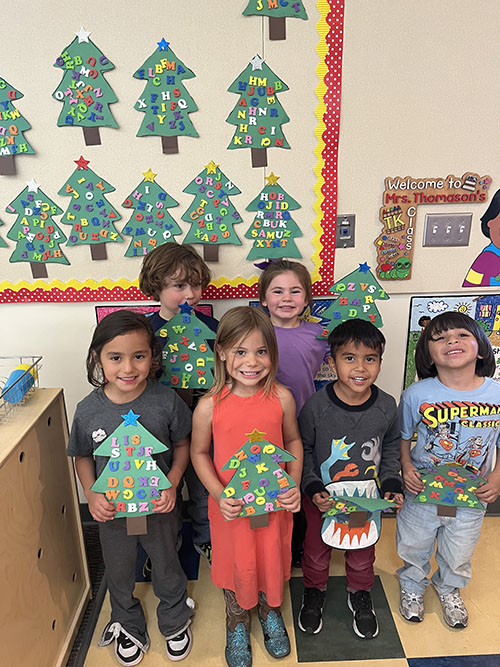 TK students posing with Chicka Chicka alphabet trees