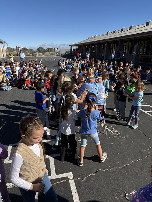 Students outside having fun with Silly String