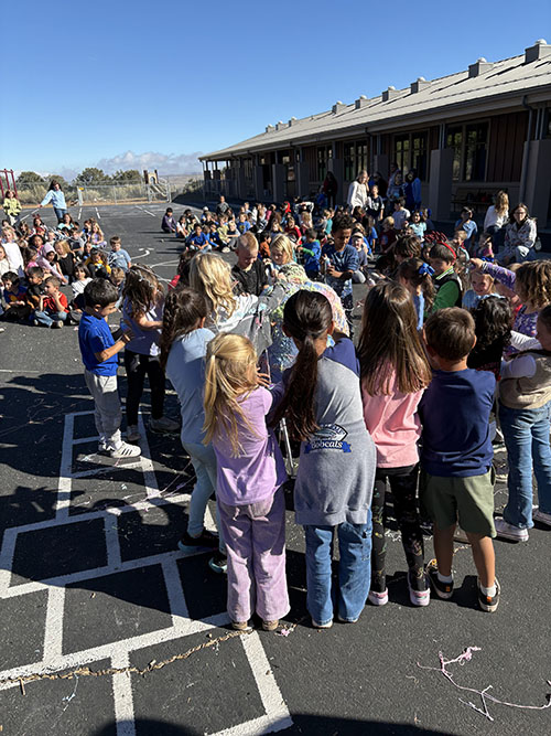 Students outside enjoying attendance award show for October