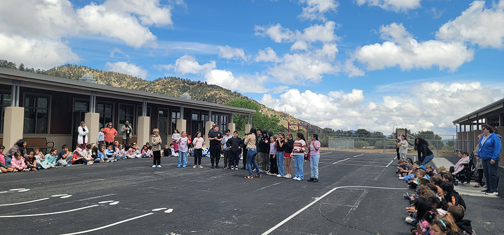 Students and teachers outside enjoying a pep rally to kick off Diagnostic III