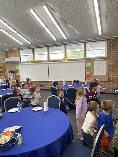Students lined up to receive pizza award