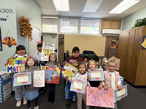 Group of students holding up their posters