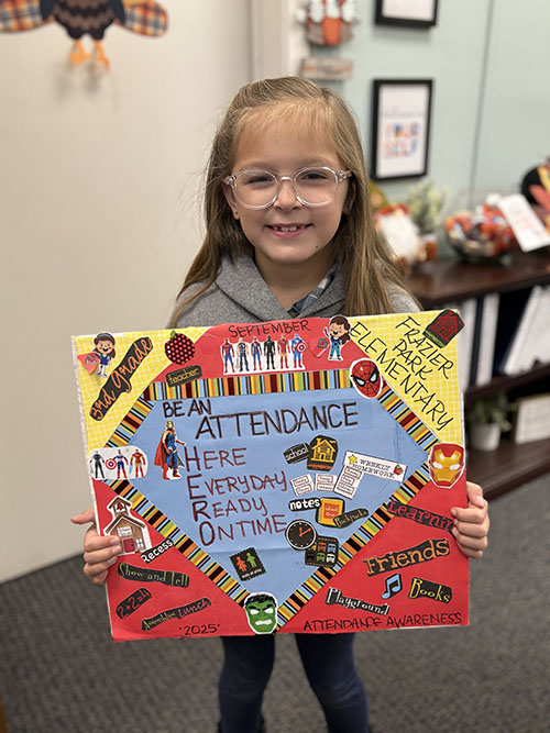 Student posing with her poster