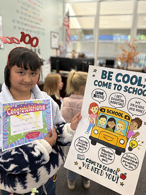Student holding up her Congratulations certificate