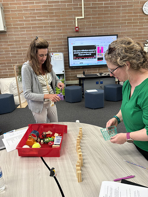 Two teachers experimenting with STEAM learning tools