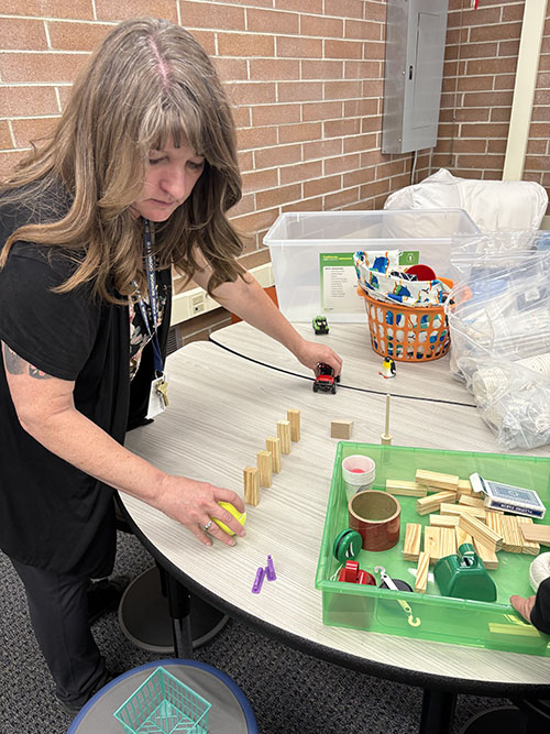 Teacher working through a STEAM activity