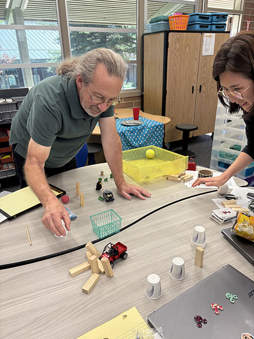 Two teachers practicing STEAM activities