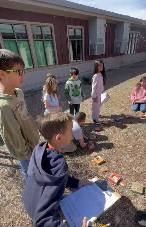 Third graders in Mrs. Page’s class outside learning about the mathematical constant π (3.14159…)