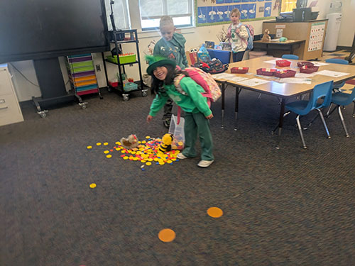 Students arriving to a magical St. Patrick’s Day morning full of surprises in their classroom