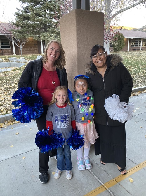 Two woman with two student elves