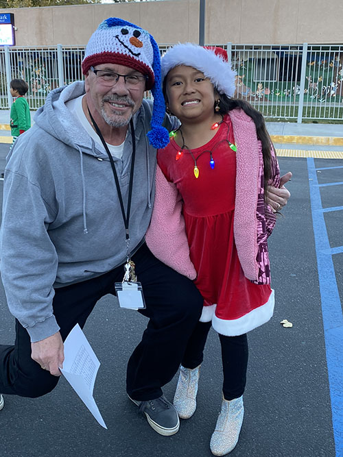 Principal with a student elf
