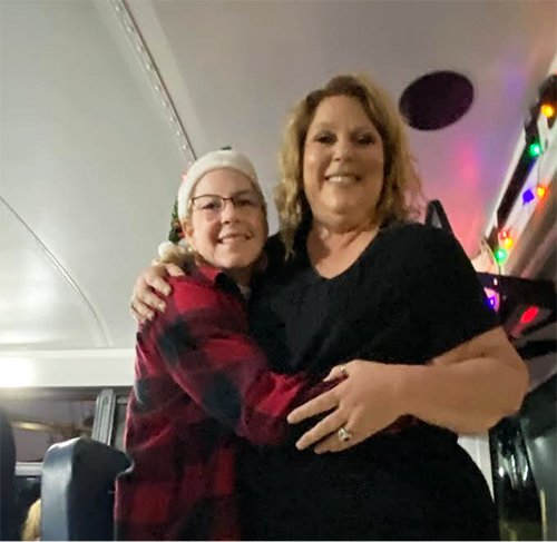 Two women hugging and posing for a picture