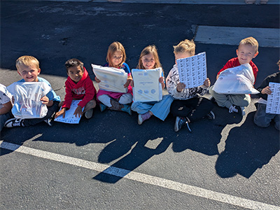 students looking at their new books
