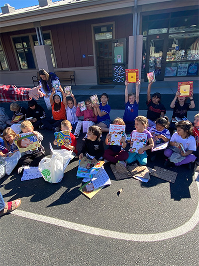 group of students showing their books