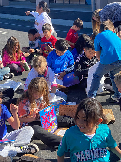 group of students reading books
