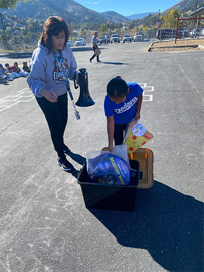 student opening a box