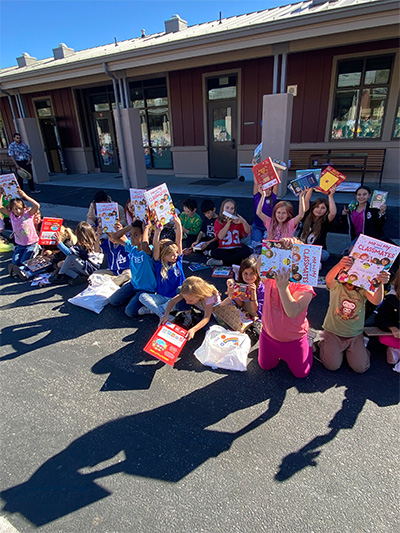 students showing books