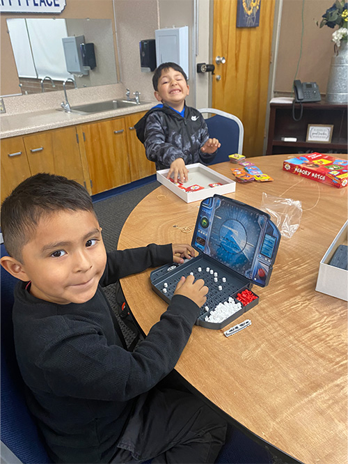 Students playing Battleship and Memory Match