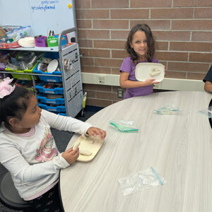 Students sculpting with clay during an art activity
