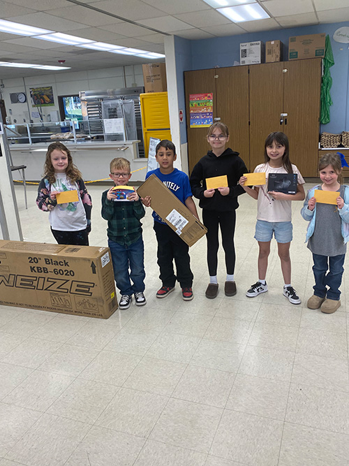Students with their sweet success fundraiser prizes