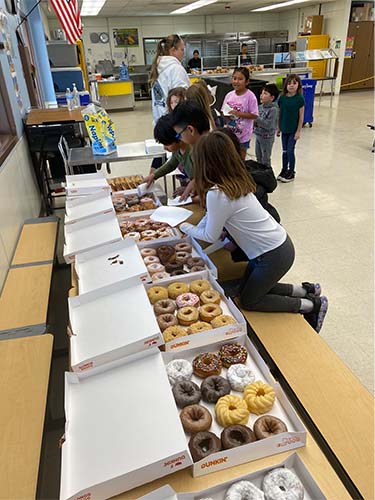 Students picking donuts